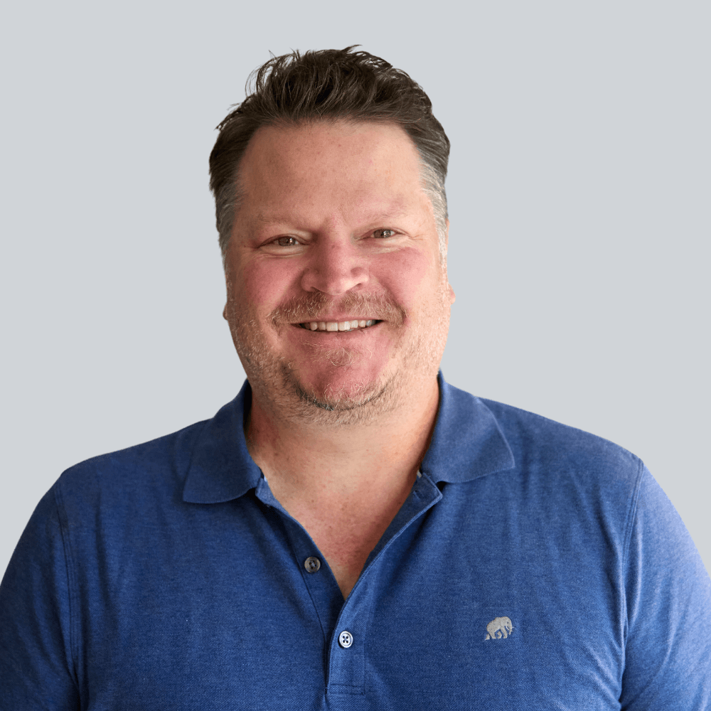 Photo of smiling man on gray background