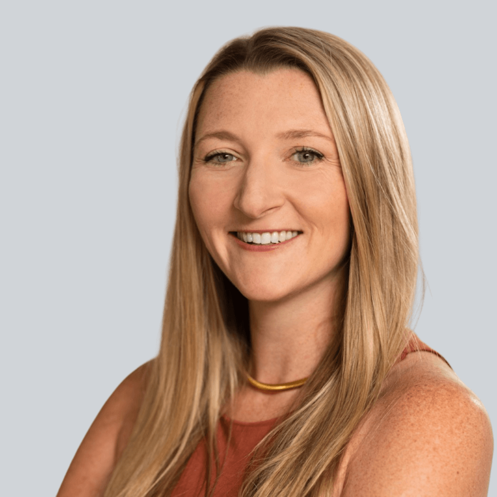 Photo of blonde professional woman on gray background