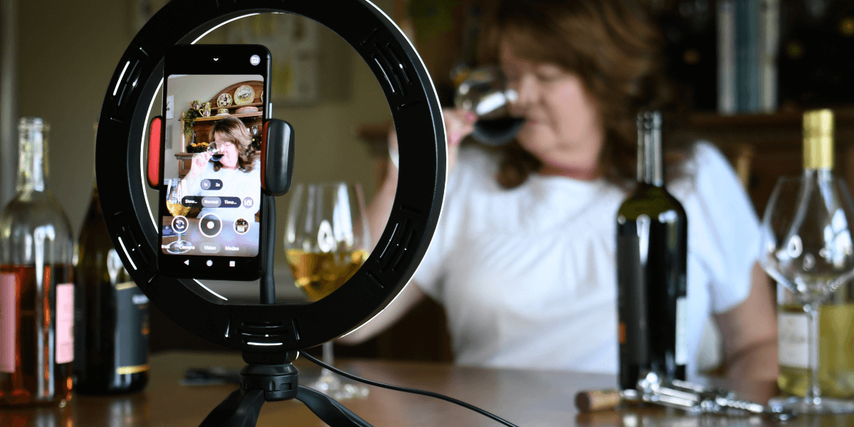 a woman hosting a virtual wine tasting