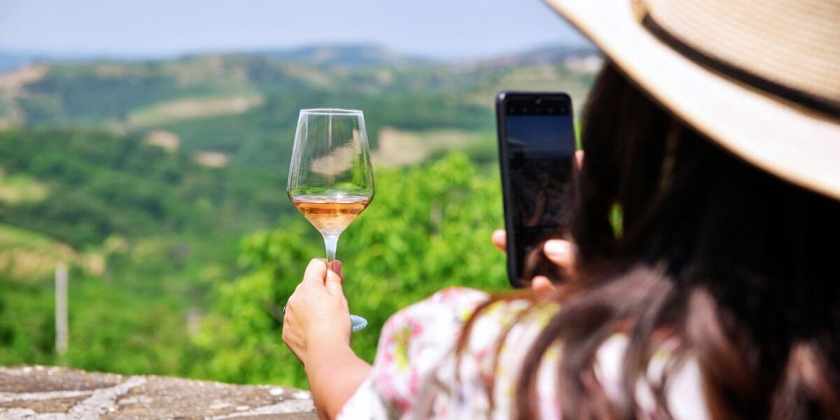 a person holding a glass of wine