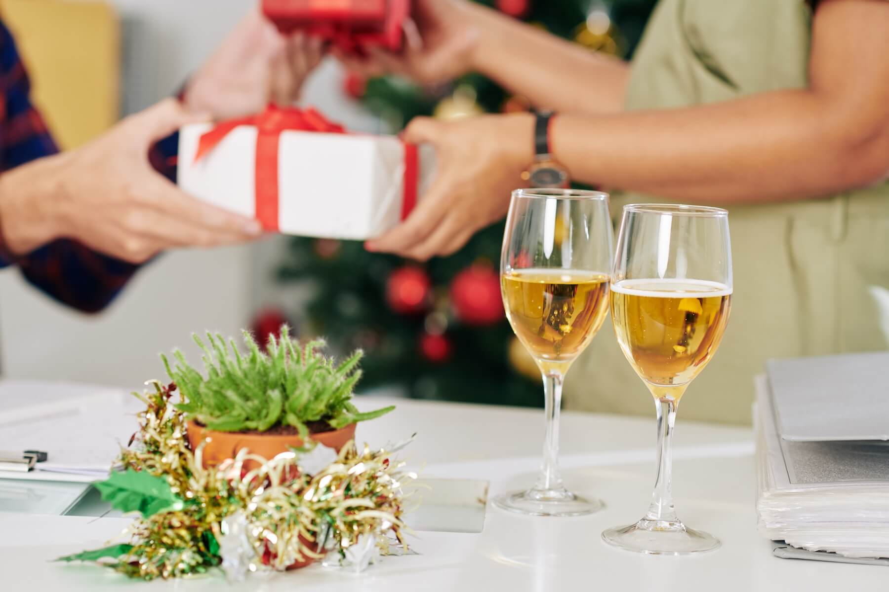 Two glasses of champagne on office table, coworkers exchanging Christmas presents in background SSUCv3H4sIAAAAAAAACnRUPY/cIBDtI+U/rFwHCWxszJVJkyZSinRRijGMd9GxxjI4yep0/z3gj132stfBG+a9BzPMy8cPh0PRgTeqeDq8pF3cG2tnHyYIxg0Rpp82fMJB45QjqE1wkwGbgx0EdRrgjBEcZmsT/LoECx8gzB59JuZPcwg4+eDUc4TZlcUcF2w8ueDywGj+BsgBVlZTn4BMSEHAY3R2J7Xf8+e6P+yBJRgzYqj4jm60WGzcq8O5S5Fvxiu0FgZ0sy/2+Kr3DtkPjA/hrDteHhF+cedxTle/ka2LX/vN4IiDutxukCAL50t+h6QmWgZtx0nfC0F4qyVpeY8EJUqmQDaUyjsDuu60KAGJkpQSLmJCV8qKaGS9VLqlnMmrqd1NEteuw71SuQNGWVM+ynhbxTzpq7NGw8XfWfs8ezOg94/I9IRw9sEsnXUnH8VzElHfbZmkj+jedF5O2N7l81v2unjNOm1Ci7C29MZQVEKwthGS1FrH5204I1DqmrSyEV1bNxBfeBco+pbHivGOSCn6VLyWSC2QgJJ9CVoJzdmivzovnv9Ez+elrTcHMGvjsjb/7RTYdKDKbI6TUWY4ZmkunJbPvKcpNw9hSr1VXM1Z50bo4n94OvSRE3f8BN7H43rH858XR4c7ZzqDC8vrbKyFjl8zbVlVclHTpqa1KEVF2VbDbUicTORZ7OwG59E60JhEb//h7fhoaEWrklX7dHg0SdYzdV3ezlyHyhprmLzFrvNljQnZ/t8Fi4DReVlMMlow1WOjKSMUYkPwigKBvqSEcahbUXXRRh3L+/oPAAD//wMA9qZziYoFAAA=