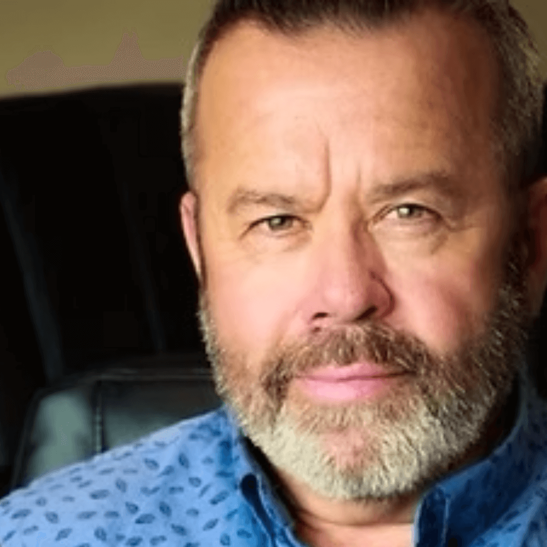 A photo of a man in a blue shirt. His name is Tom Rappe.